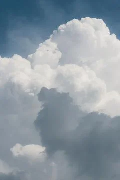 White thunderclouds in blue sky. summer cumulus clouds before rain. Beautiful Stock Photos