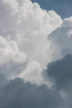White thunderclouds in blue sky. summer cumulus clouds before rain. Beautiful Stock Photos