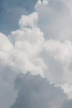 White thunderclouds in blue sky. summer cumulus clouds before rain. Beautiful Stock Photos