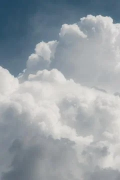 White thunderclouds in blue sky. summer cumulus clouds before rain. Beautiful Stock Photos
