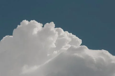 White thunderclouds in blue sky. summer cumulus clouds before rain. Beautiful Stock Photos