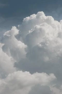 White thunderclouds in blue sky. summer cumulus clouds before rain. Beautiful Stock Photos