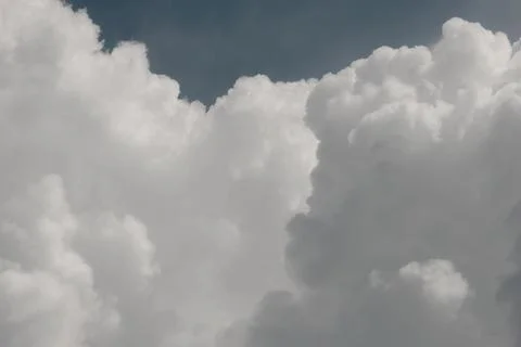 White thunderclouds in blue sky. summer cumulus clouds before rain. Beautiful Stock Photos