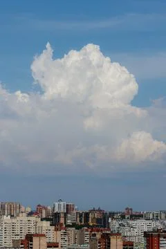 White thunderclouds in blue sky. summer cumulus clouds before rain. Beautiful Stock Photos