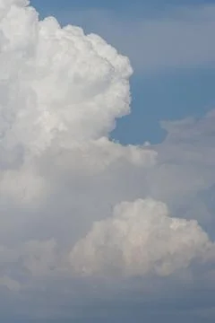 White thunderclouds in blue sky. summer cumulus clouds before rain. Beautiful Stock Photos