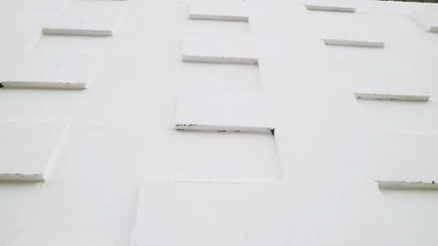 White tile wall with a textured 3D geometric pattern Stock Photos