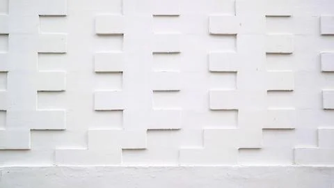 White tile wall with a textured 3D geometric pattern Stock Photos