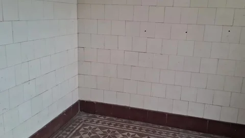 White tiled wall interior corner showing panning Stock Footage 345975583