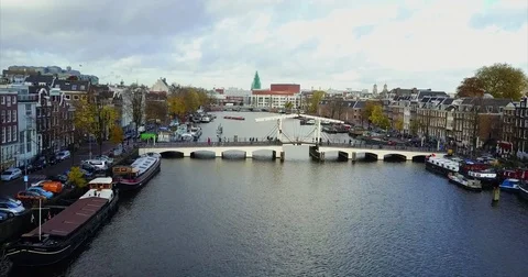 White timber drawbridge spanning a wide city river Stock-Footage 71291142