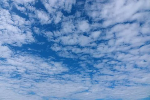 White tiny clouds over blue sky background. Stock Photos