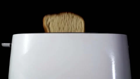           White toaster with fried bread . Slow motion, food team, close up Stock Footage 124845933