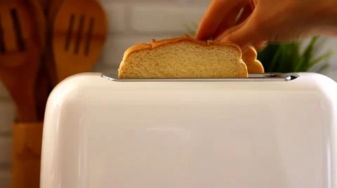 White toaster with toasts cooked in the kitchen Stock Footage 64660501