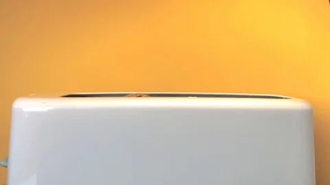 White toaster on a yellow background Stock Footage 126046601
