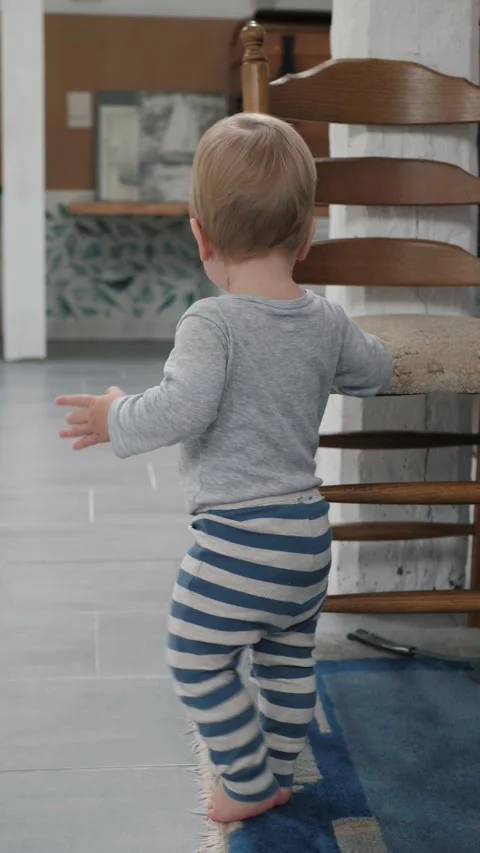 White toddler learning to walk Stock Footage 336190927