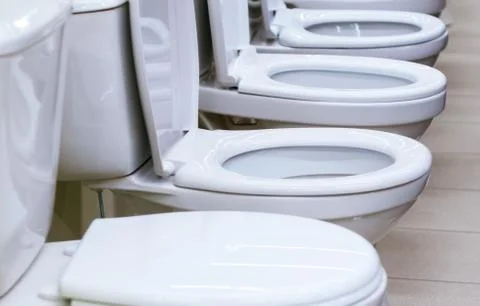 White toilets close-up selective focus. Stock Photos