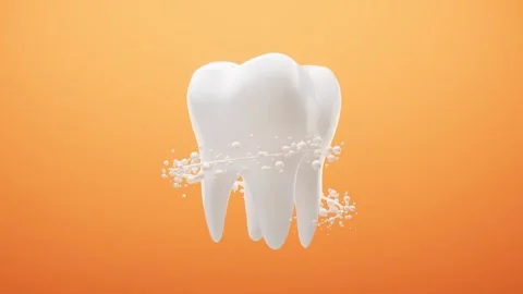 White tooth rotating with cleaning particles motion on orange background Stock-Footage 327109167