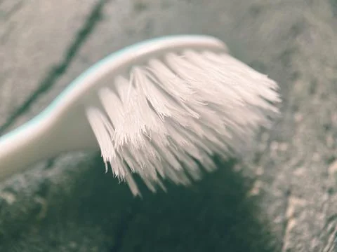White toothbrush on the dark background 写真素材