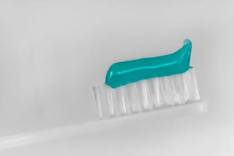White toothbrush with tooth paste macro Stock Photos