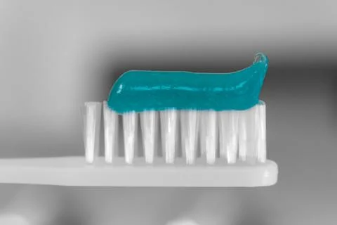 White toothbrush with tooth paste macro Stock Photos