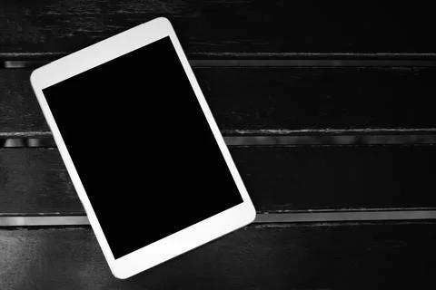 White Touchscreen tablet with black blank copy space screen for advertising.. Stock Photos
