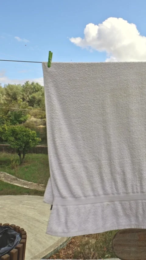 White towel drying in outdoor setting 스톡 동영상 330155599