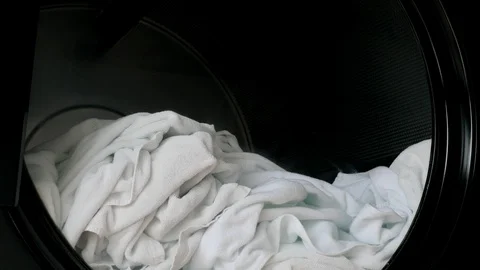 White towel in laundry machine Stock Footage 100499711