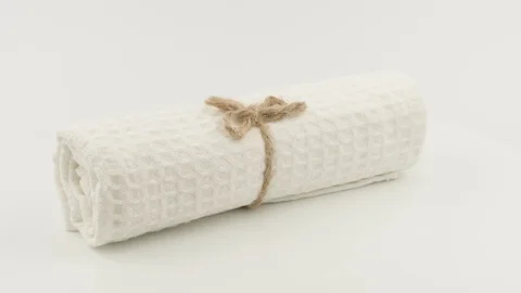 White towel rolled into a roll. White background. 스톡 동영상 129555595