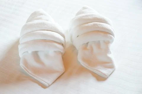 White towels on bed Stock Photos