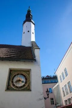The white tower and old clock in the wall in old town of Tallinn Estonia Europe Stock Photos