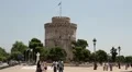 White tower and people on the waterfront in Thessaloniki, Greece HD Footage