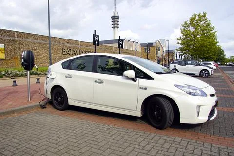 White Toyota Prius being charged Stock Photos