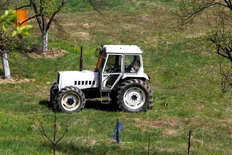 White tractor on field Stock Photos