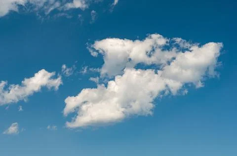 White translucent cloud against blue sky. Outdoors. Stock Photos