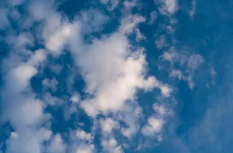 White translucent cloud against blue sky. Outdoors. Stock Photos