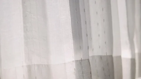 White translucent curtains on the windows while gently being blown by the wind. Stock Footage 121499458