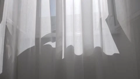 White transparent curtain swaying by the wind on a sunny summer day Stock Footage 313255443
