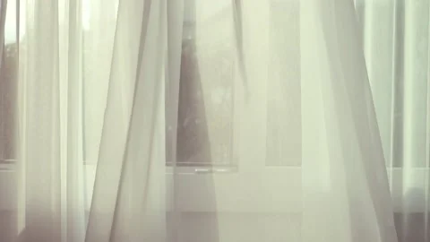 White transparent curtain on the window moved by the wind blowing background. Stock Footage 148131998