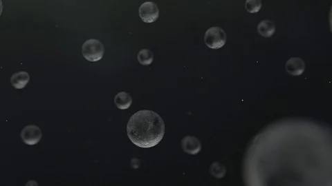 White transparent spheres flying and unate in one element in dark abstract space Video stock 97825053