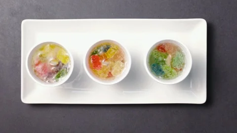 A White Tray With Soft Drink And Gummy Bears In Styrofoam Cups Видео 87842758