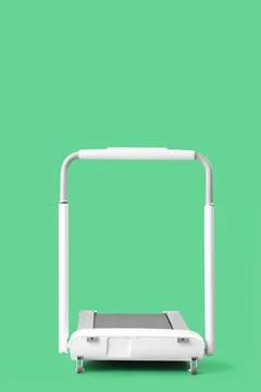 White treadmill on green background Stock Photos