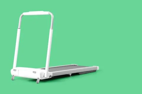 White treadmill on green background Stock Photos