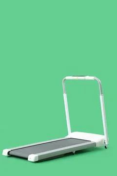 White treadmill on green background Stock Photos