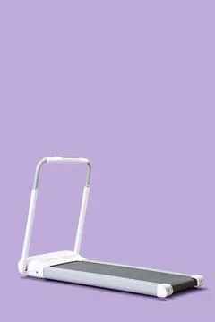 White treadmill on lilac background Stock Photos