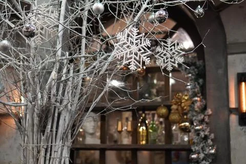 White tree branches decorated with silver balls on the background of a mirr.. 스톡 사진