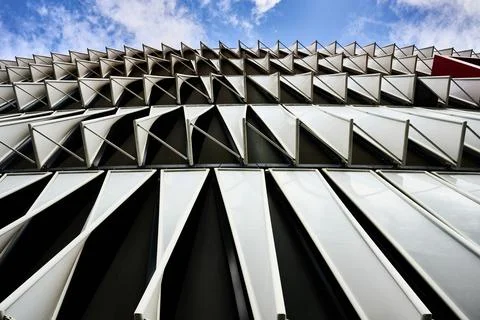 White triangular window shades creating a dynamic pattern on a contemporary b Stock Photos