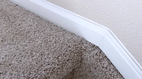 White trim on staircase corner above carpet Stock Footage 327855755