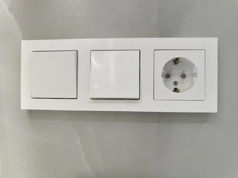 White Triple Electrical Panel with Switches and Socket Stock Photos