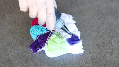 White Tshirt being Tied Dyed Tutorial Style Stock Footage 202821755