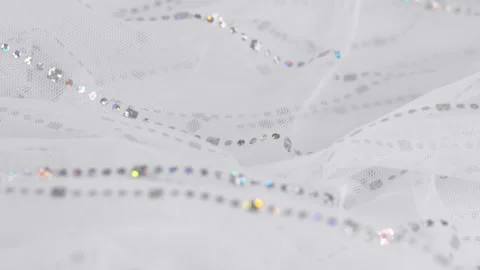 White tulle fabric with silver glitters. Textile material tissue background Stock Footage 312053330