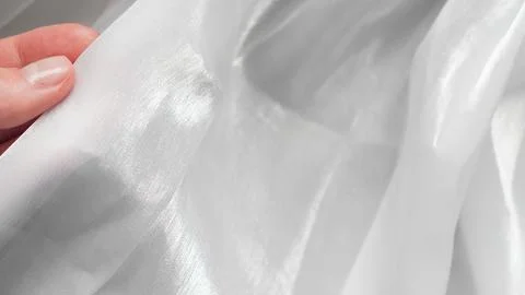White tulle textile background with soft folds creating gentle minimal aesthe Stock Photos